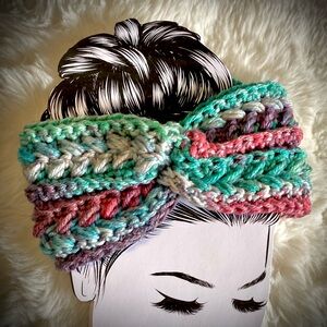 Hand made, crocheted headband/ ear warmers. Features shades of aqua/purp…